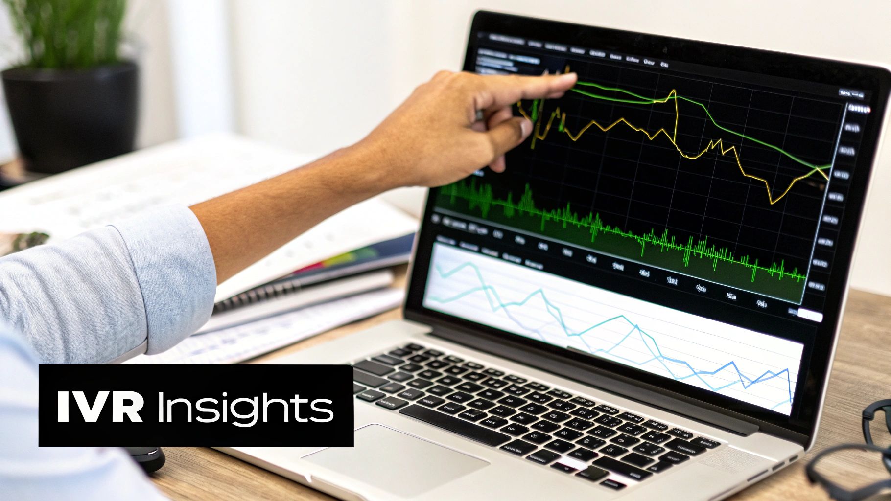 Person pointing at a laptop screen displaying data charts, symbolizing IVR insights analysis.