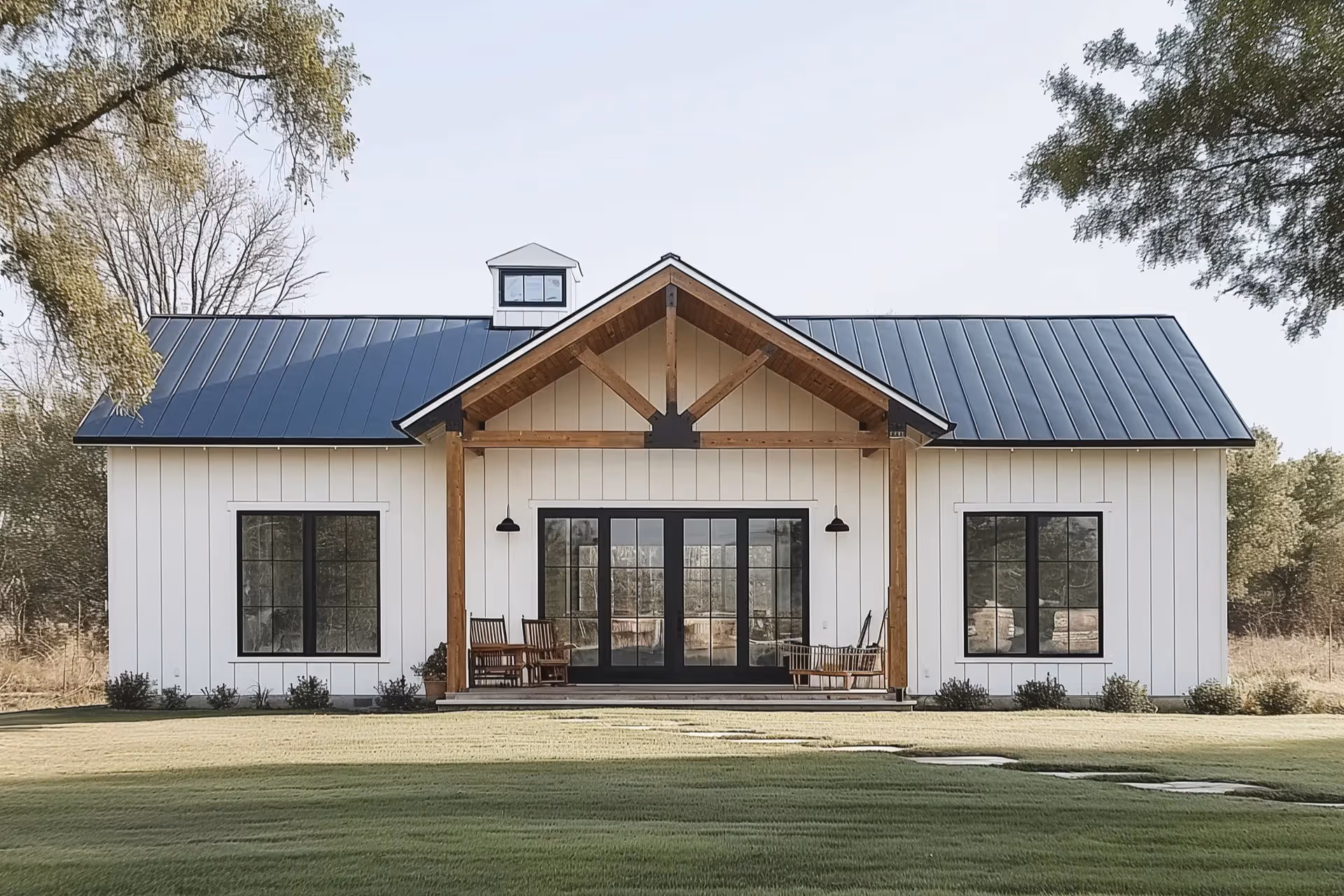 Traditional barndominium with white exterior paint and wood framing