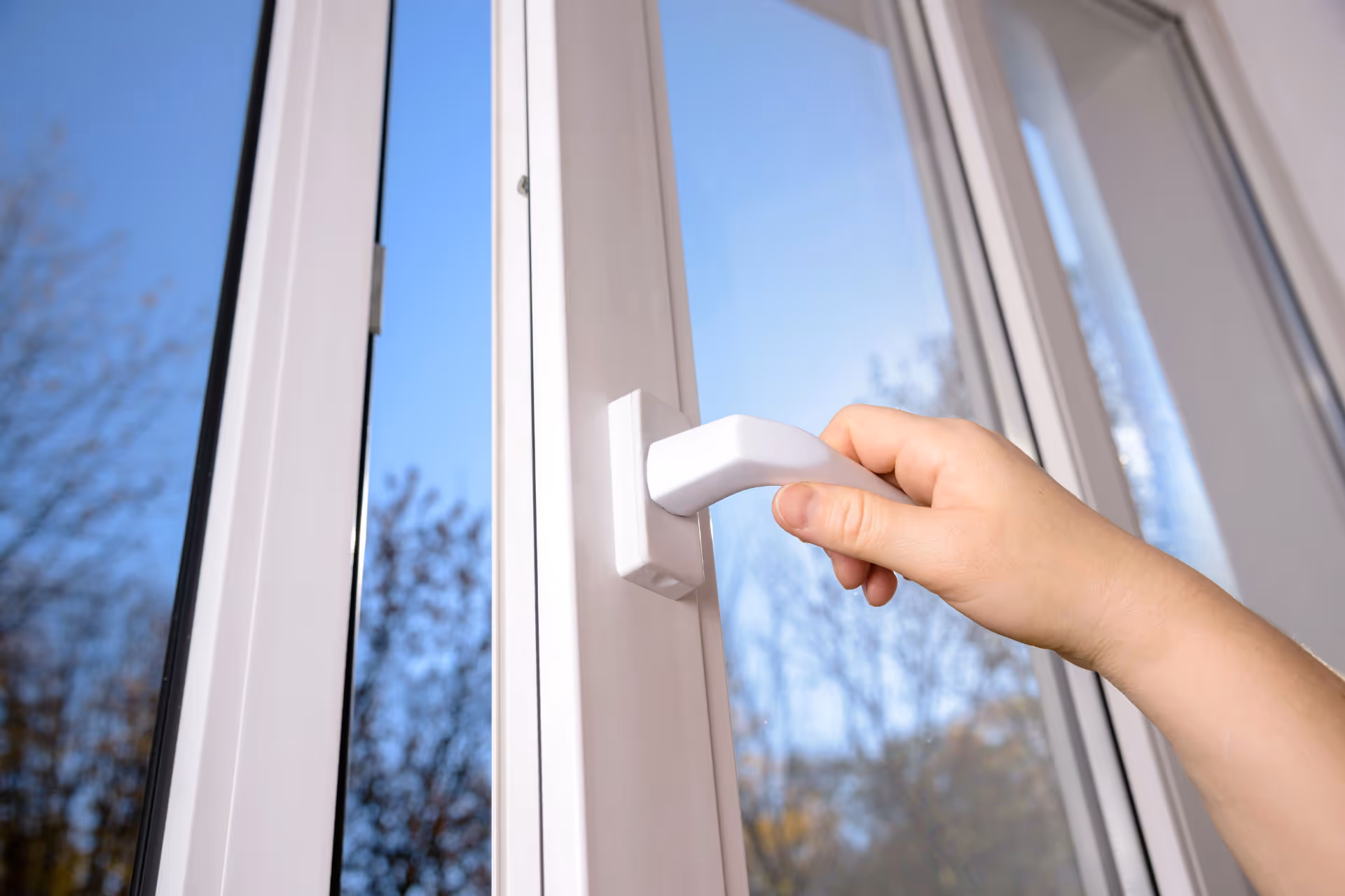 Person opening casement window