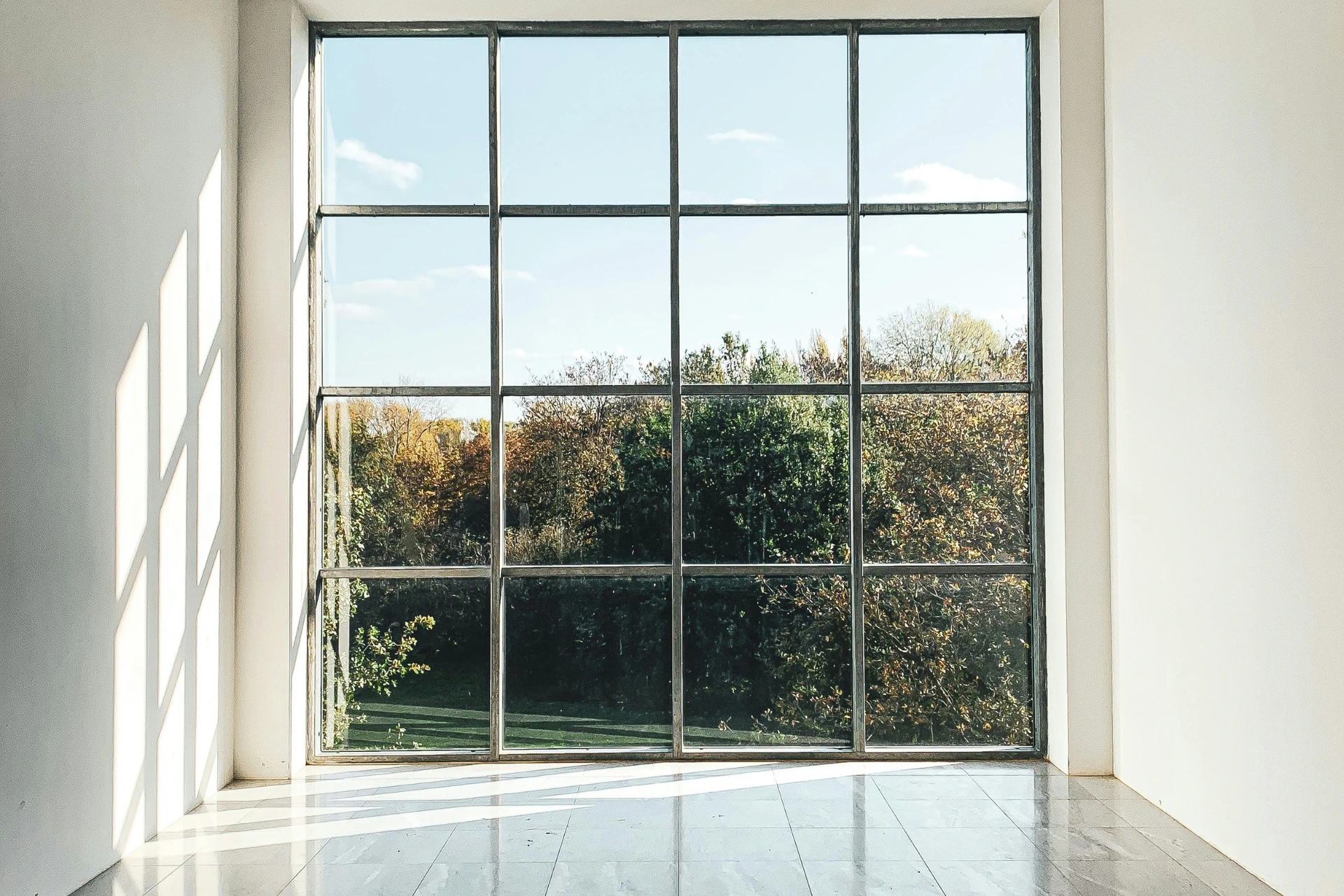 a bright room with a window letting in light