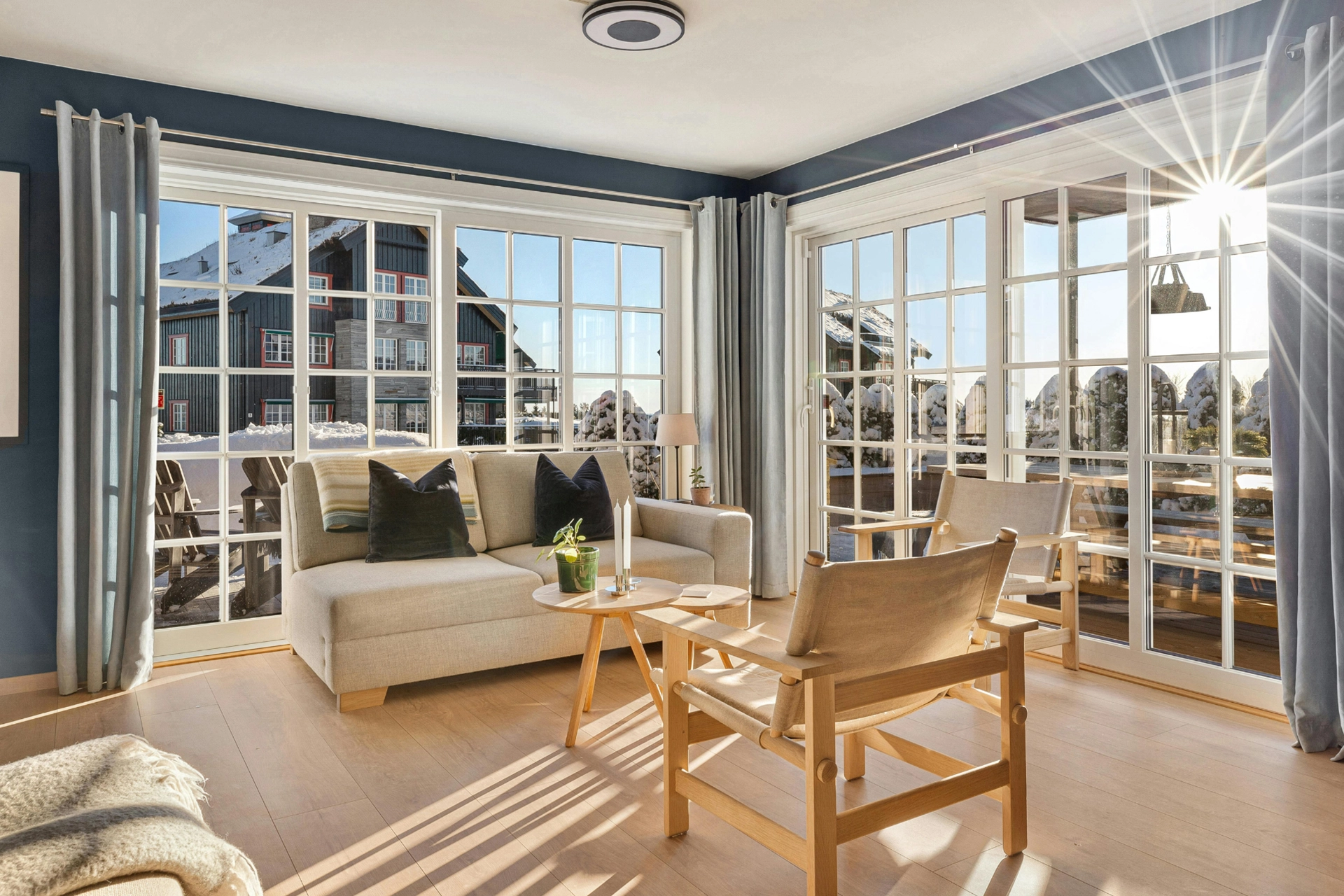 A large living room with floor to ceiling, whole house window replacement