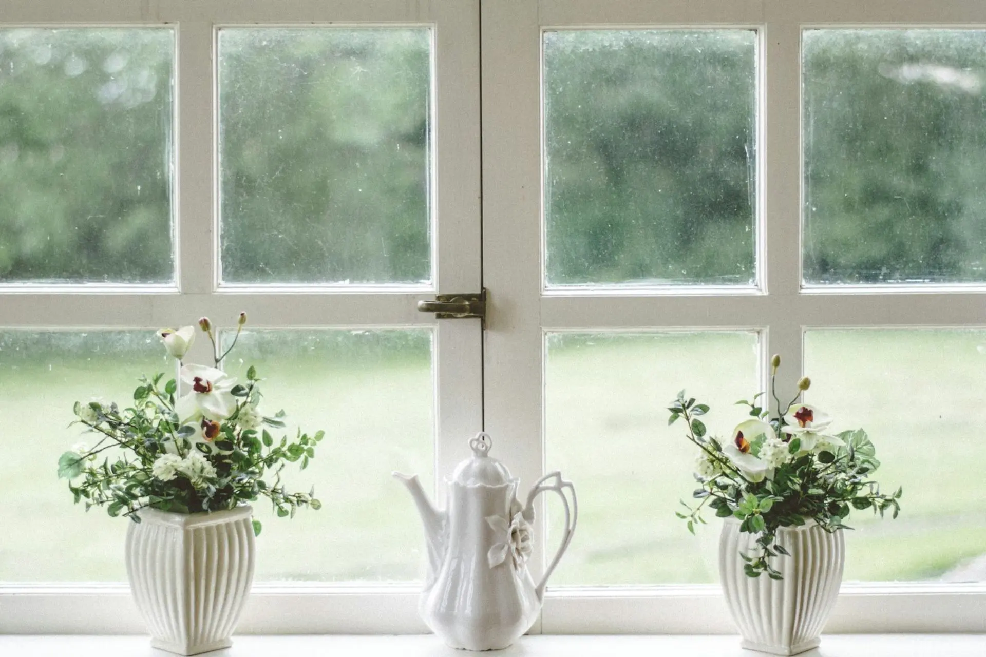 White windows with dirty, stained windows