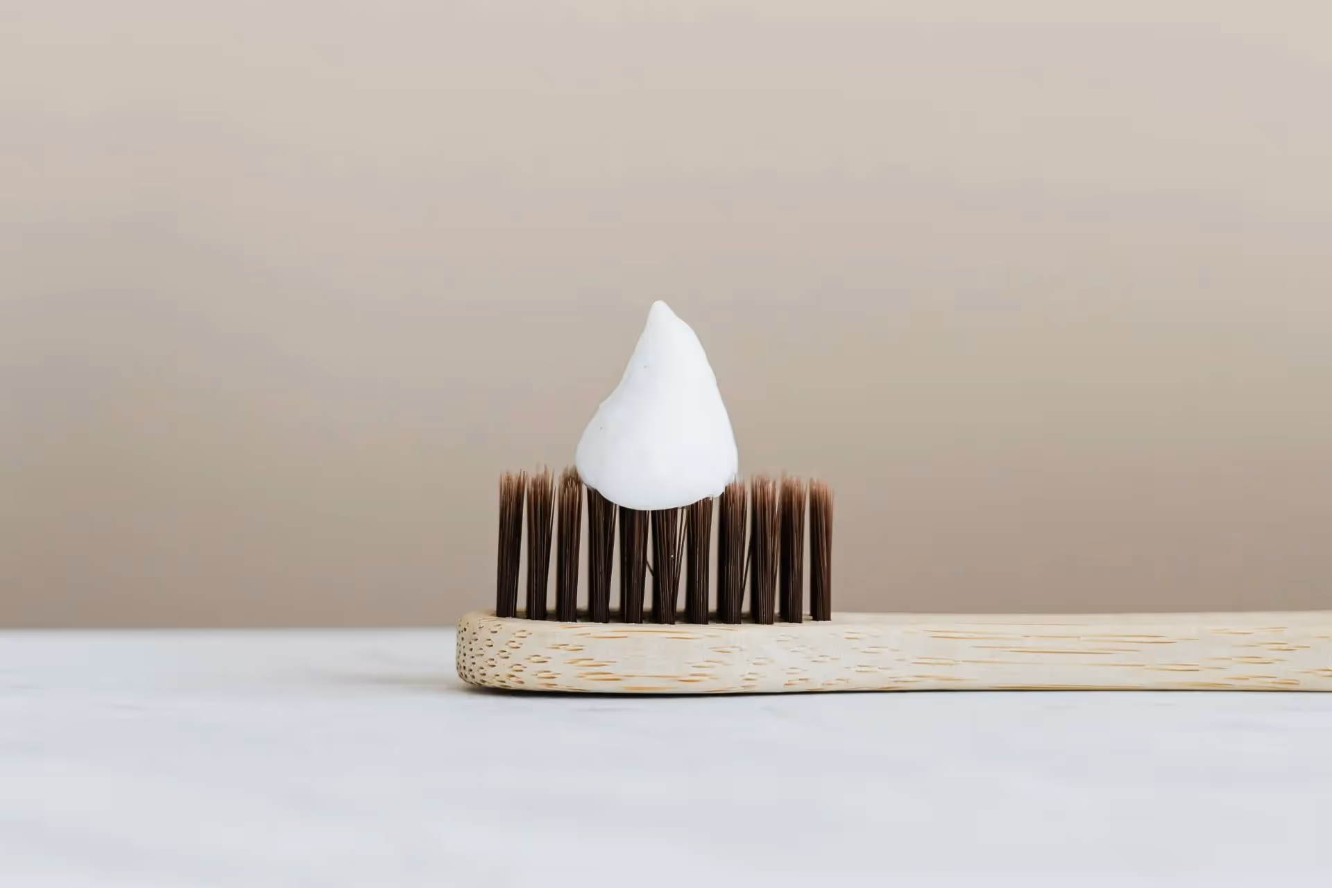 A toothbrush with toothpaste on the bristles