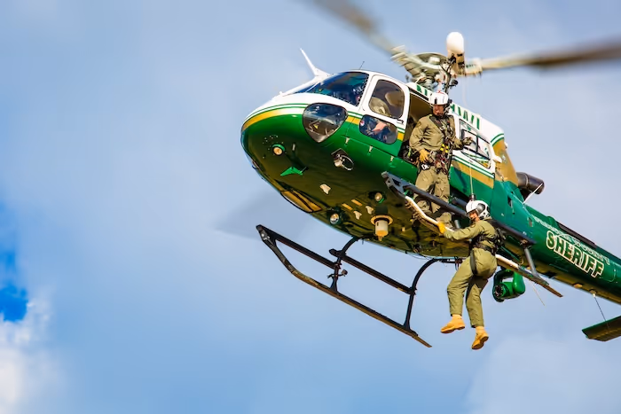 Officer coming down from helicopter