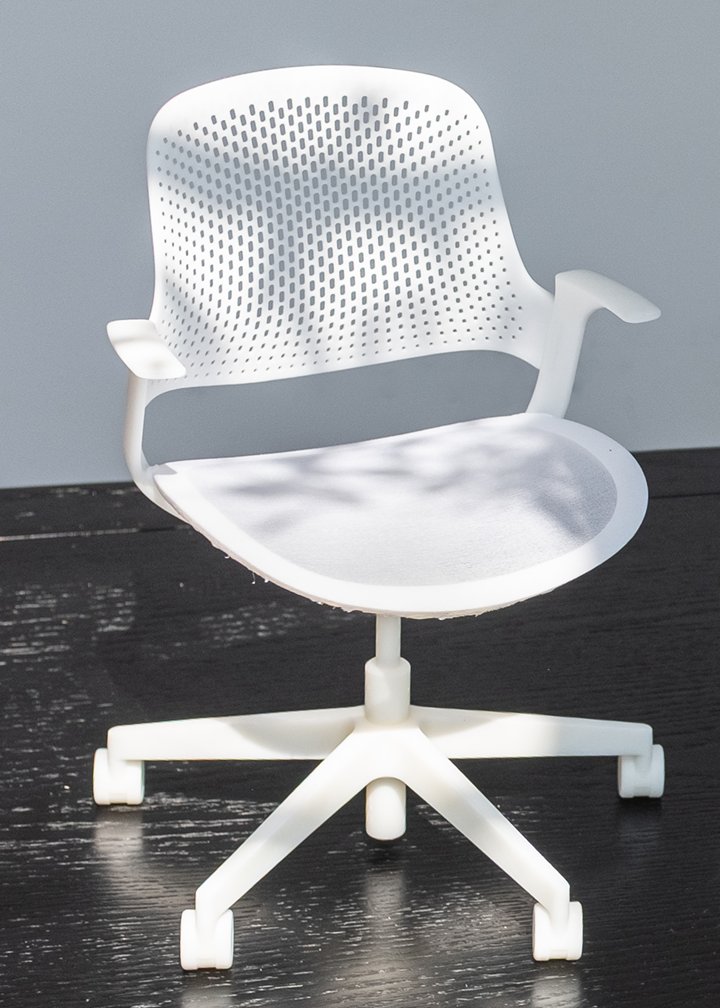quarter scale prototype of an office chair concept with a mesh seat and plastic backrest