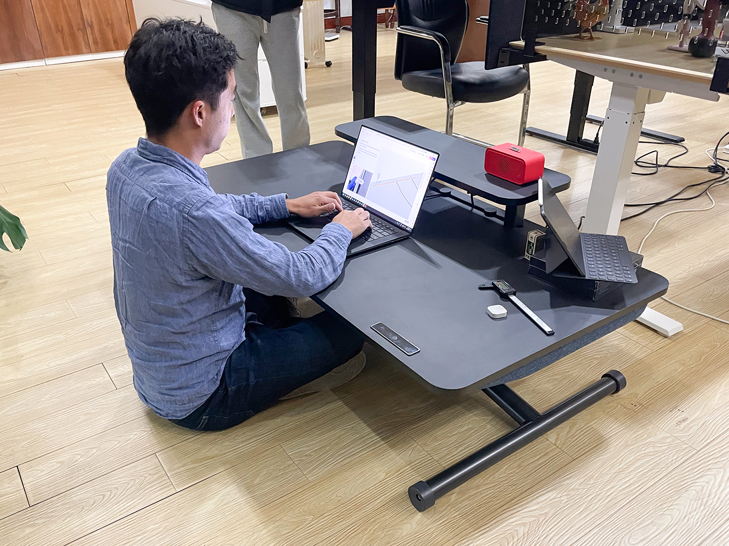 Designer testing a prototype of the marinamantra flow desk