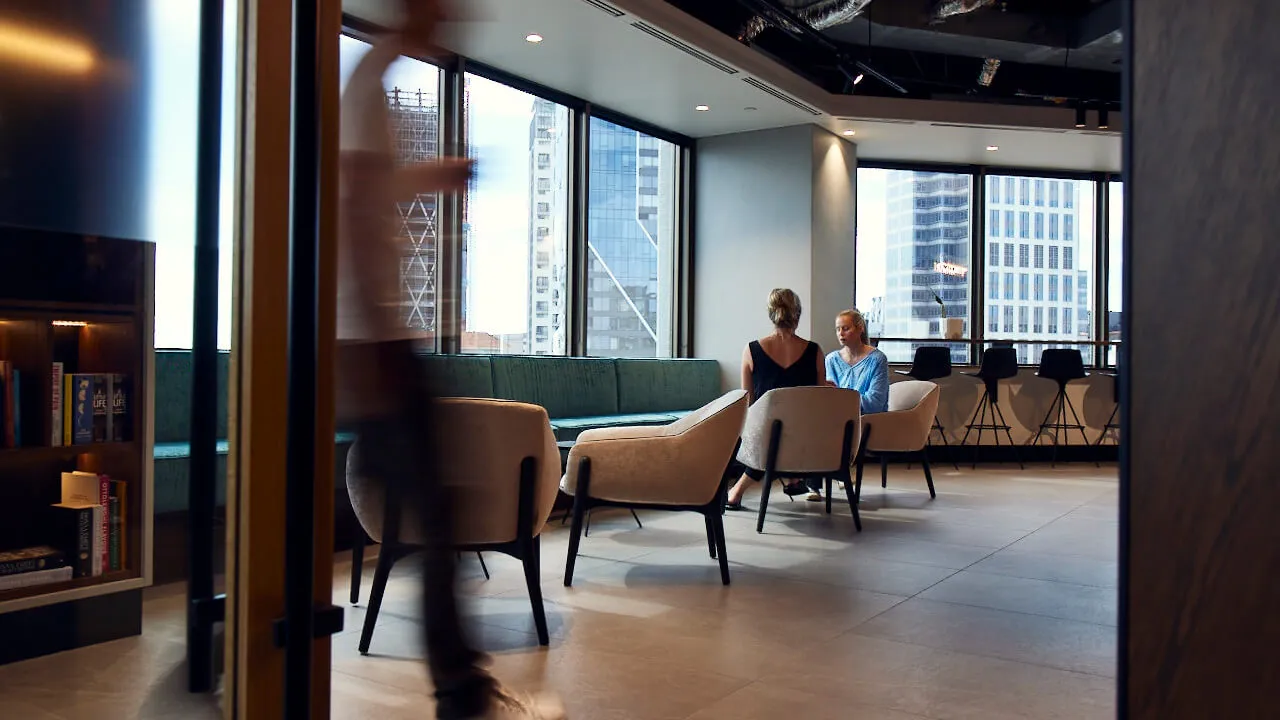Two people sitting at a table talking