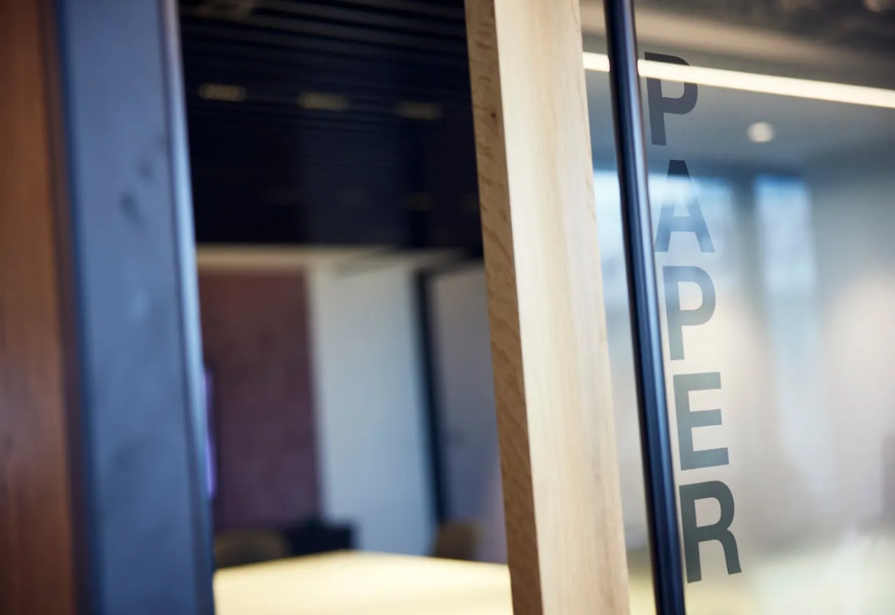 The word paper on a window