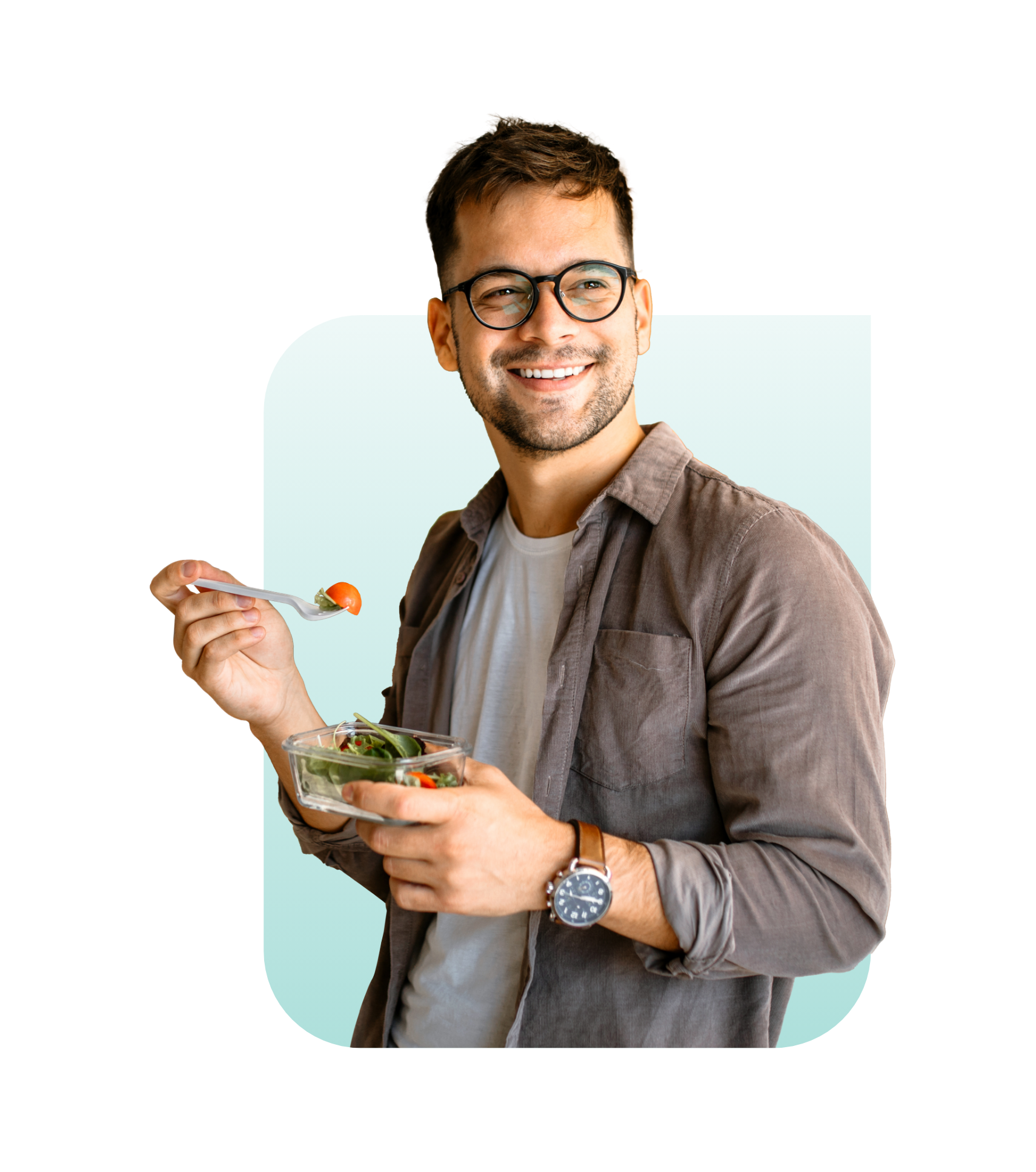 Happy young male eating salad