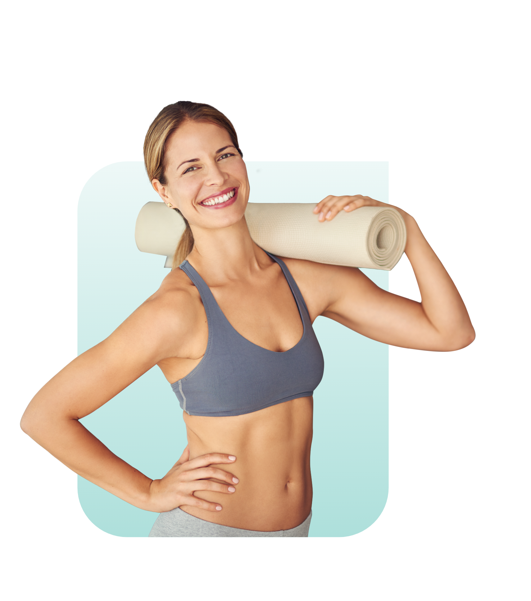 Fit bodied female smiling and holding a yoga mat