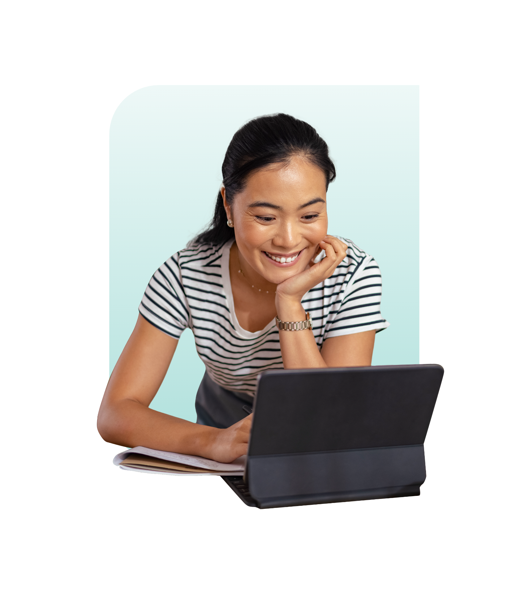 Asian female smiling looking into a computer screen
