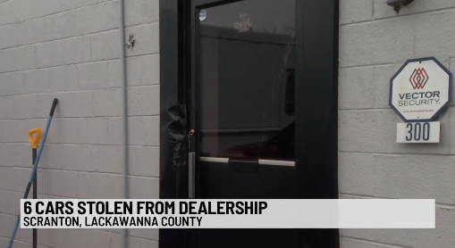 Dealership door that was broken into., image