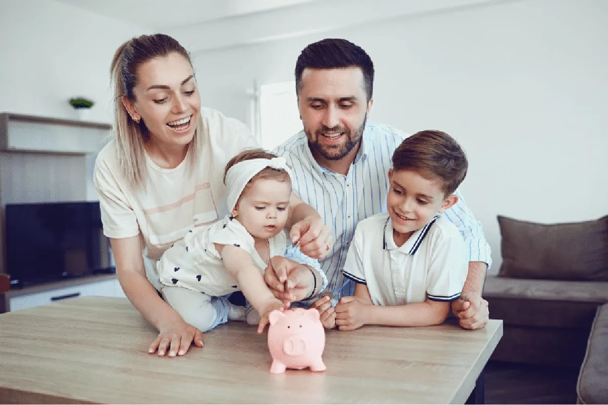 family looking at piggy bank
