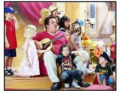 man singing to children