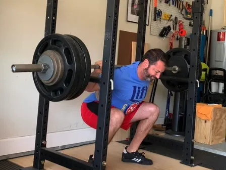 jeff performing barbell squat