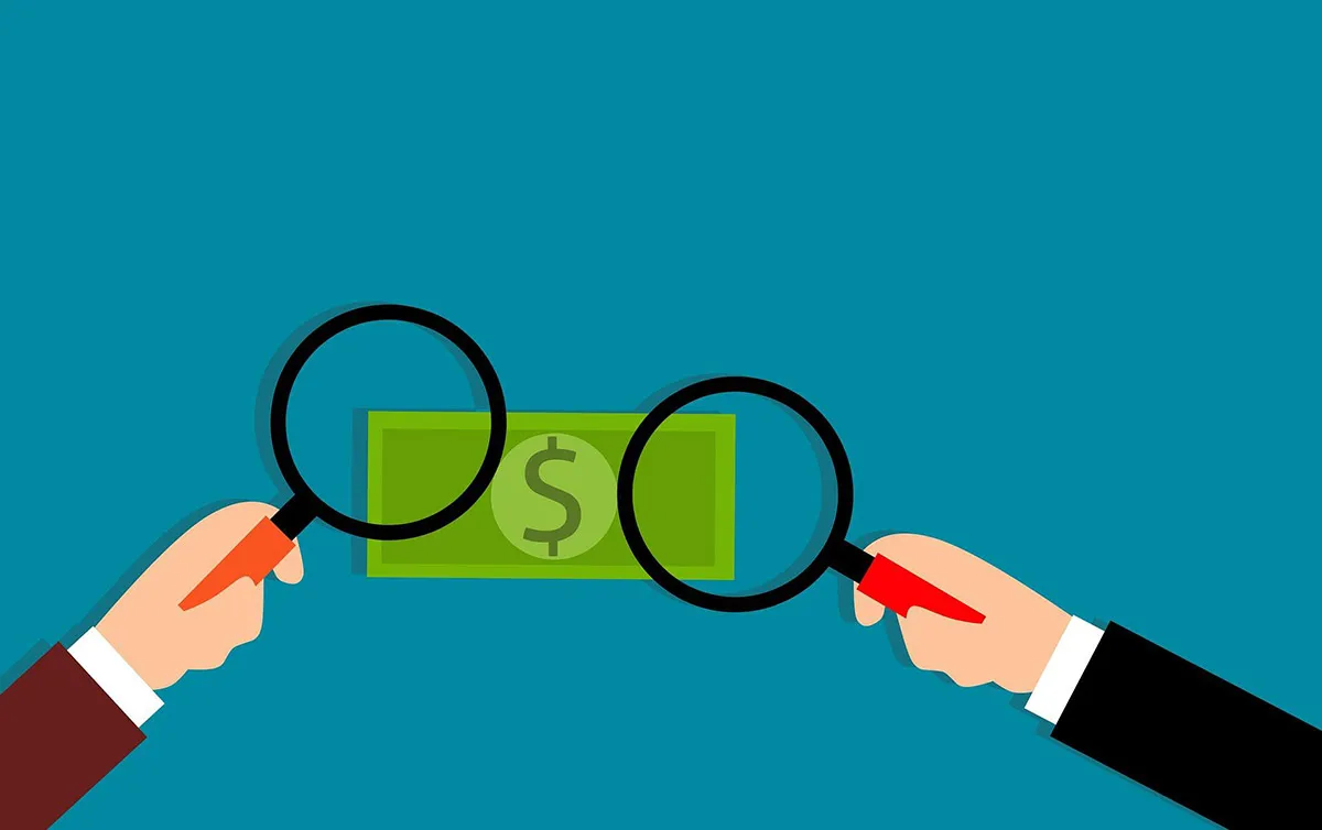 illustration of magnifying glass examining money
