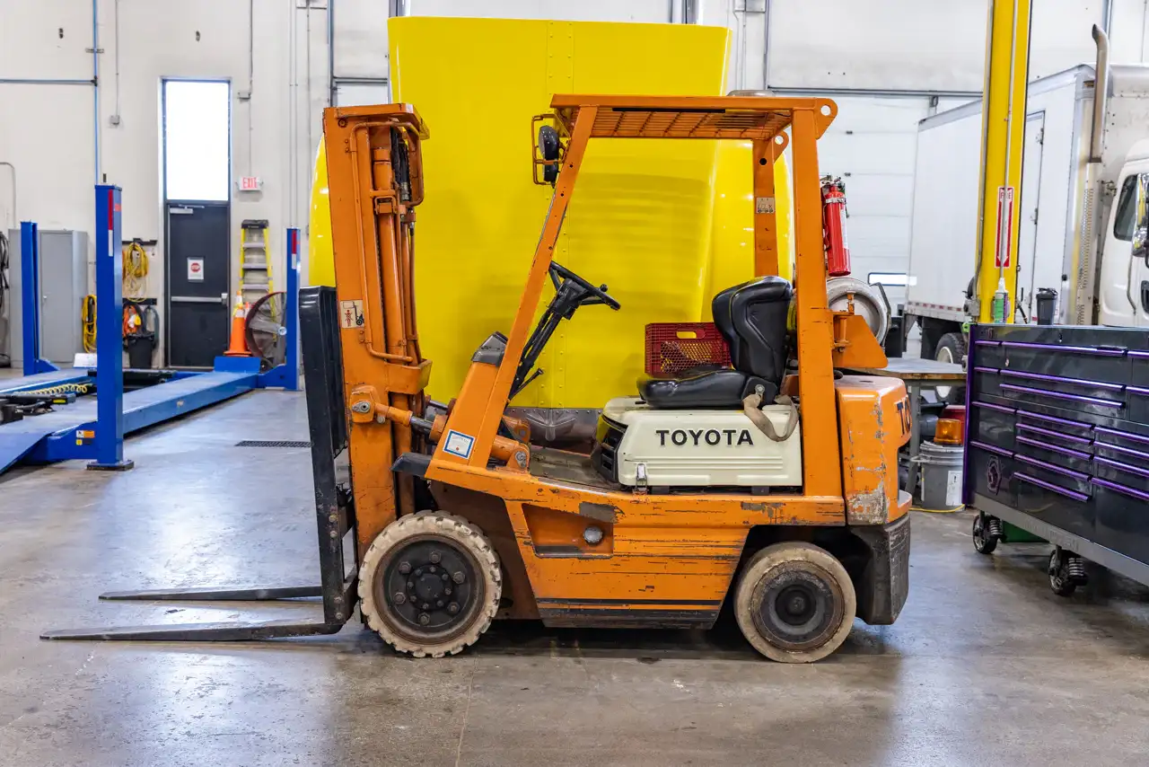 Mechanic performing construction forklift repair in Jackson, NJ