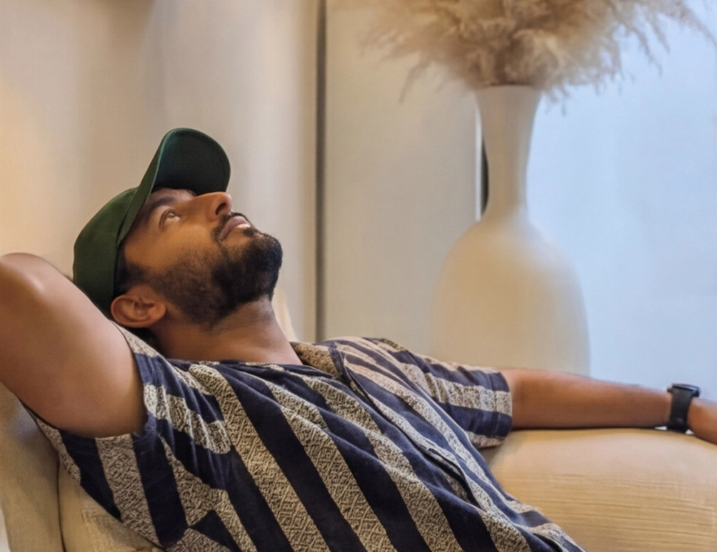 Nikhil Sharma relaxing in a lounge between projects, reflecting the work-life balance of running a remote-first agency