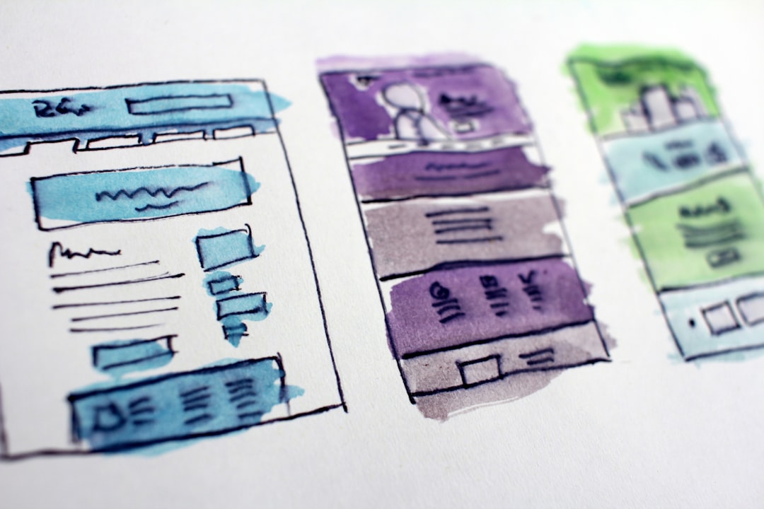 Hand-drawn website wireframes with colorful sketches, illustrating the design process for UI/UX development in a digital agency.