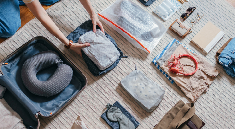 Photo of a person packing their suitcase