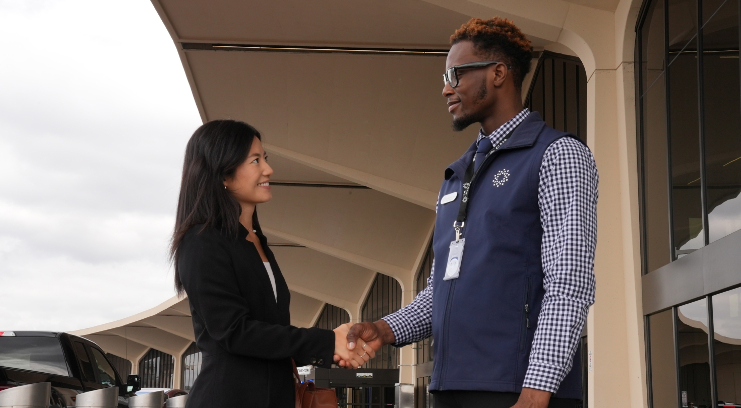 Woman shaking hands with CLEAR Ambassador