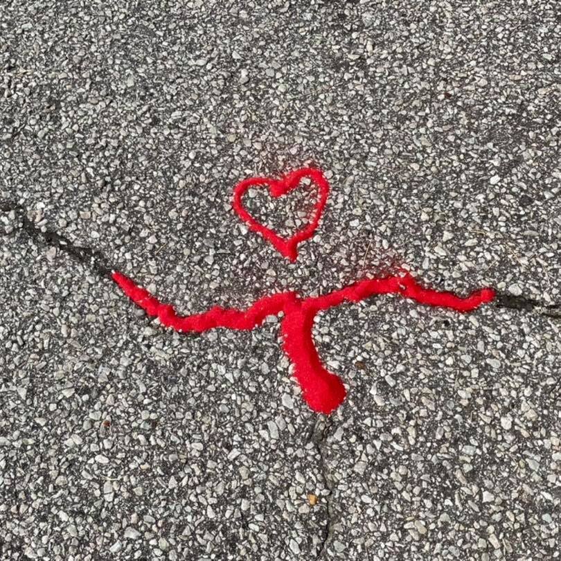 Red sand in a crack of the concrete for a campaign to raise awareness about human trafficking.
