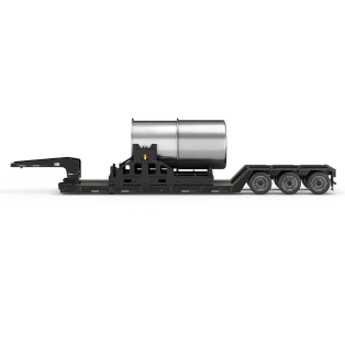 Black heavy-duty flatbed trailer with a large cylindrical metal tank secured on it.
