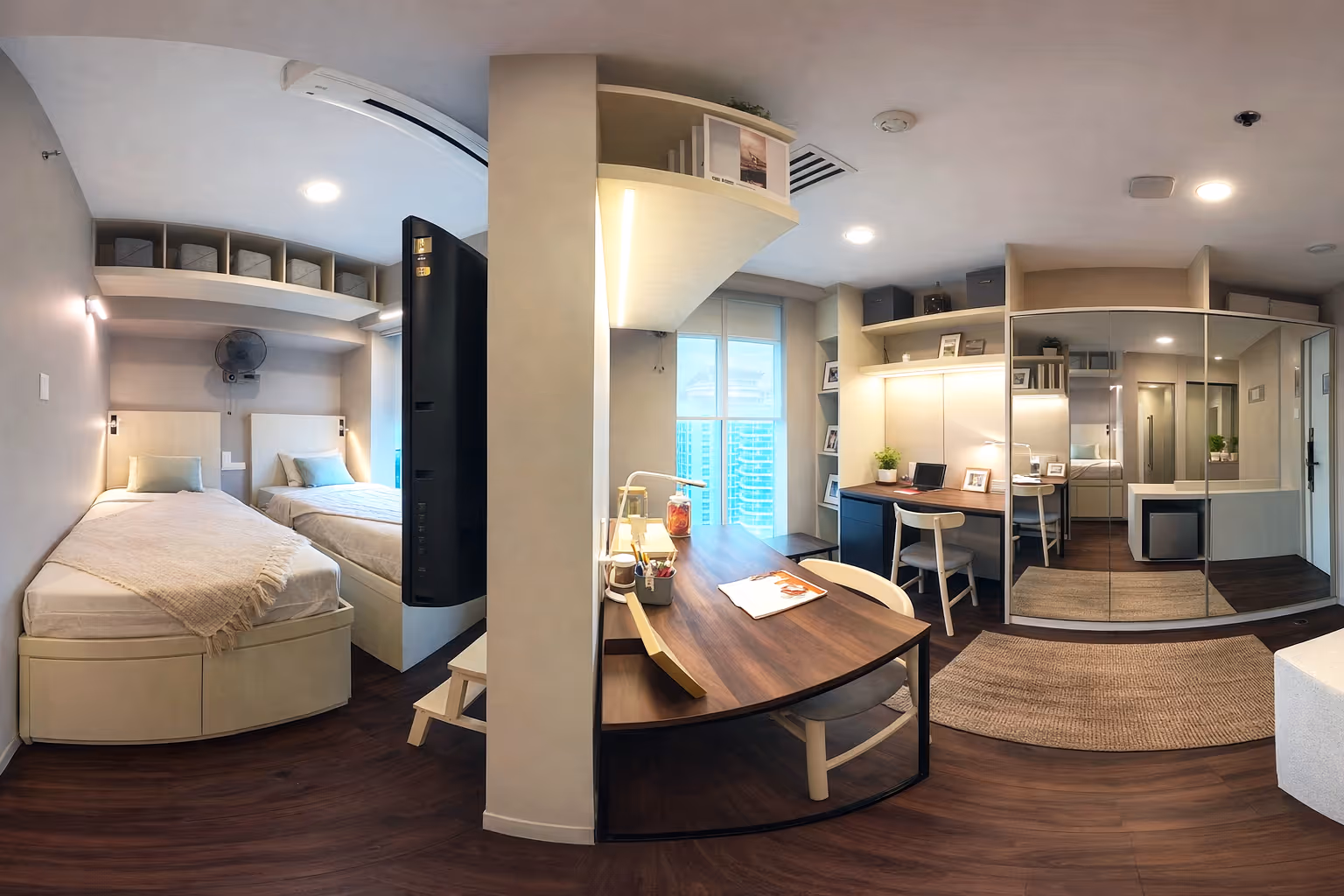 Modern studio bedroom with two twin beds, a wall-mounted TV, wooden desk with chairs, and mirrored closet doors.