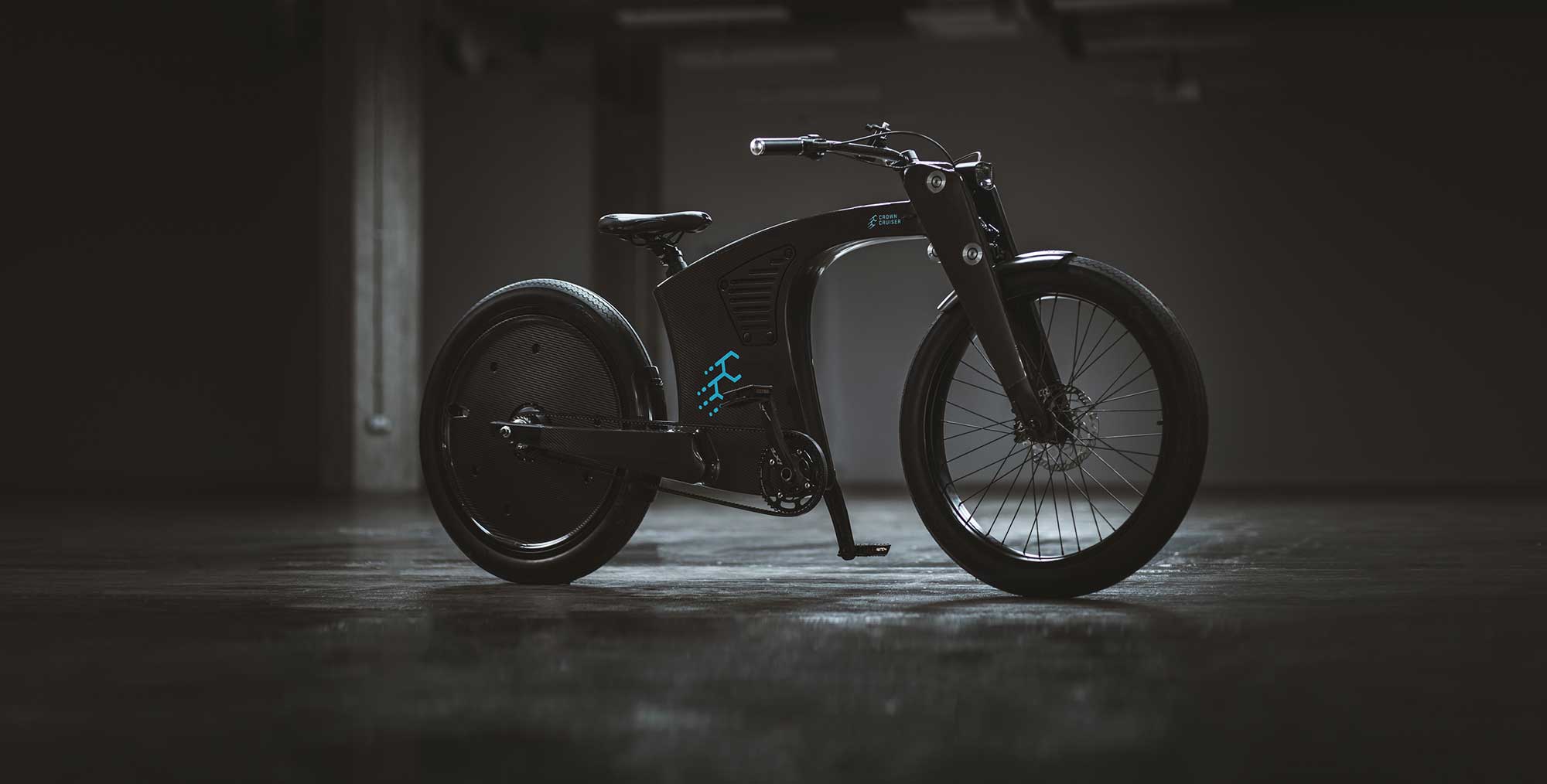 Side view hero shot of the crown cruiser electric bike in a well lit stylish warehouse