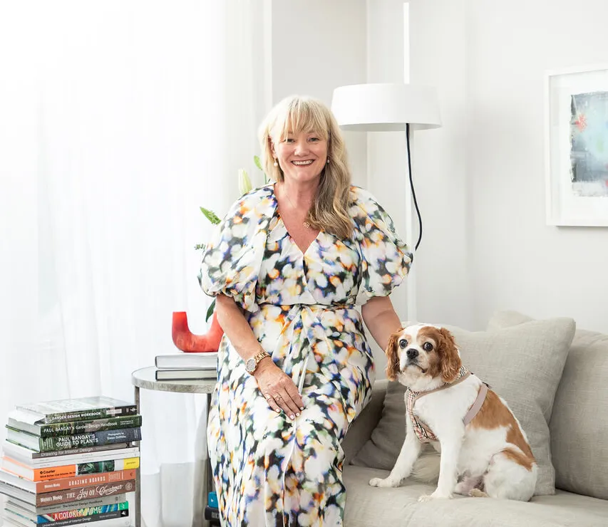 Janette and her dog in understated modern living room