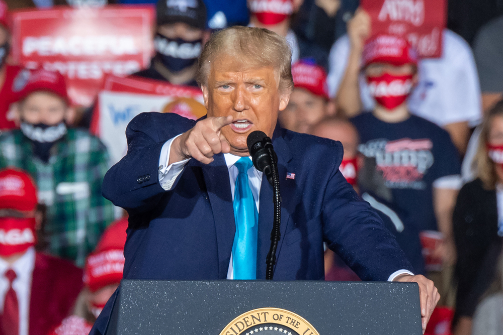 Donald Trump pointing at the camera during a rally