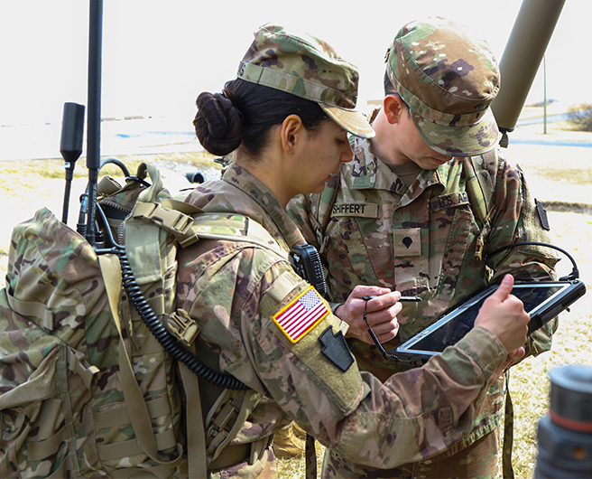 Soldiers review data from EW equipment in