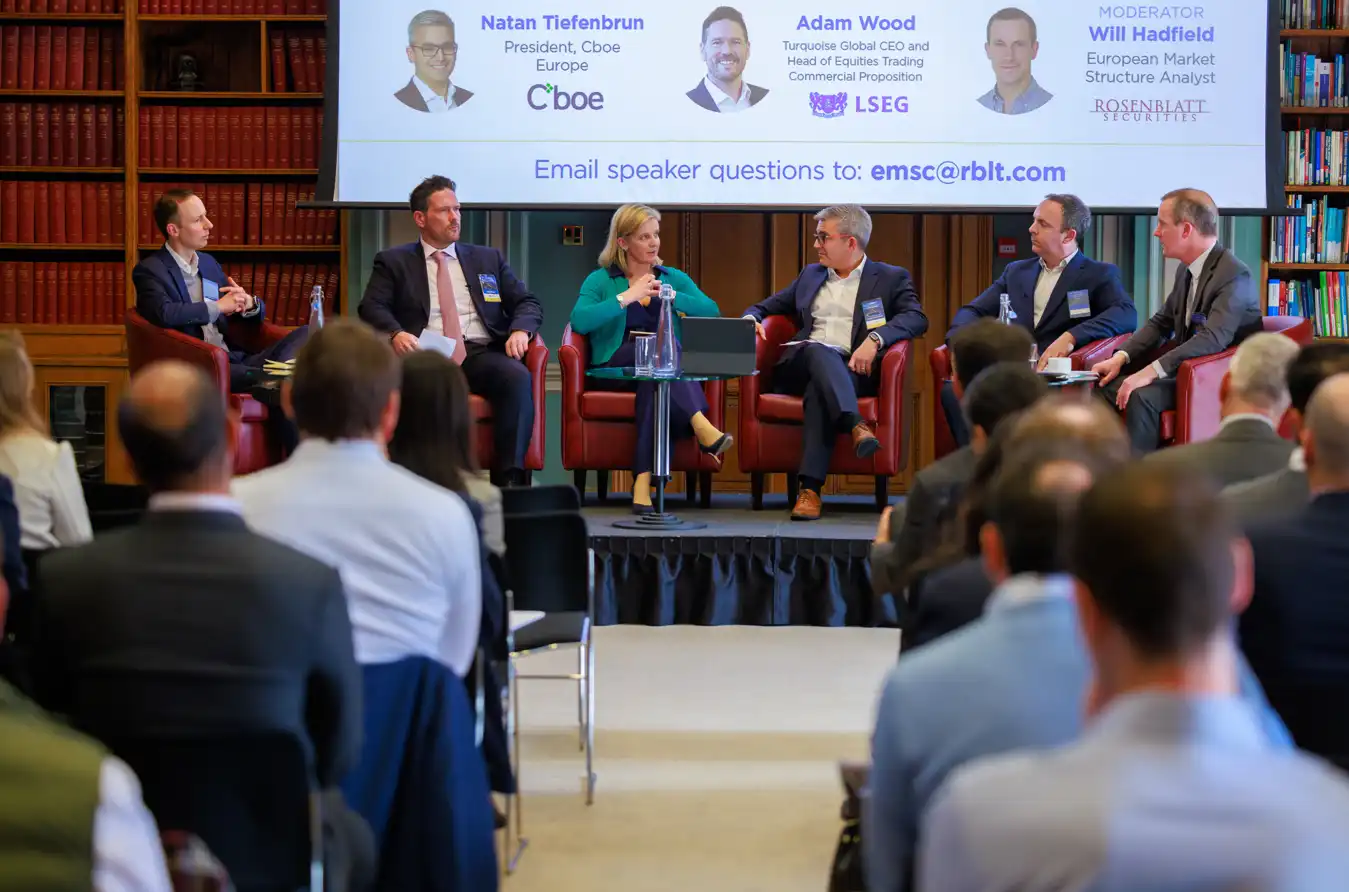Natan Tiefenbrun, Adam Wood, and Will Hadfield on a panel at a Rosenblatt Securities event, discussing European market structure in a library setting.