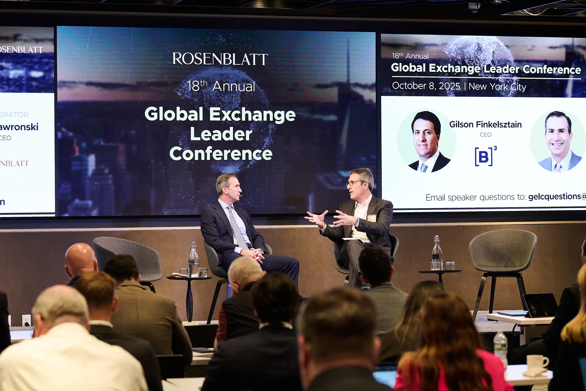 Joe Gawronski and Gilson Finkelsztain hold a firechat presentation on stage at the Global Exchange Leader Conference in NYC.