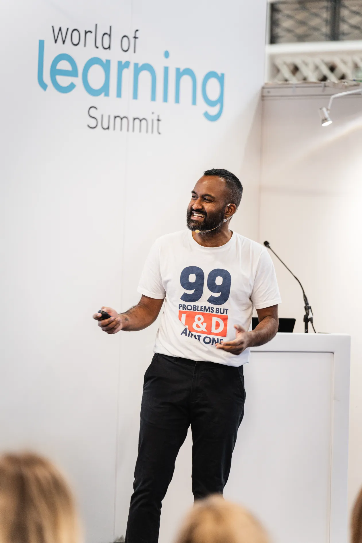 Nelson Sivalingam delivering a keynote on workplace learning at an L&D event