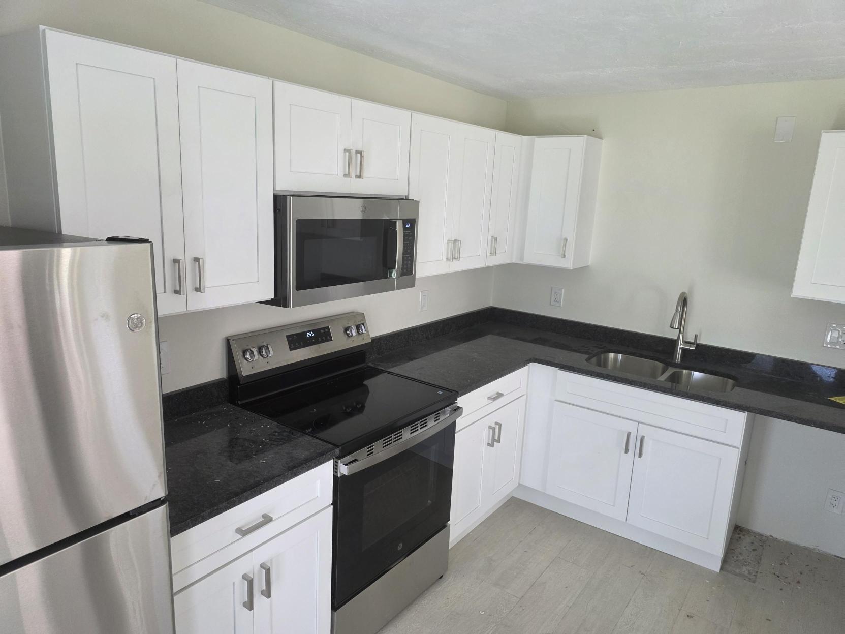 white cabinets, stove, and refridgerator