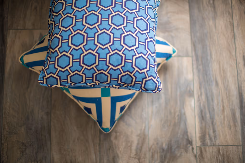 Performance fabric bue pillows and tile floor