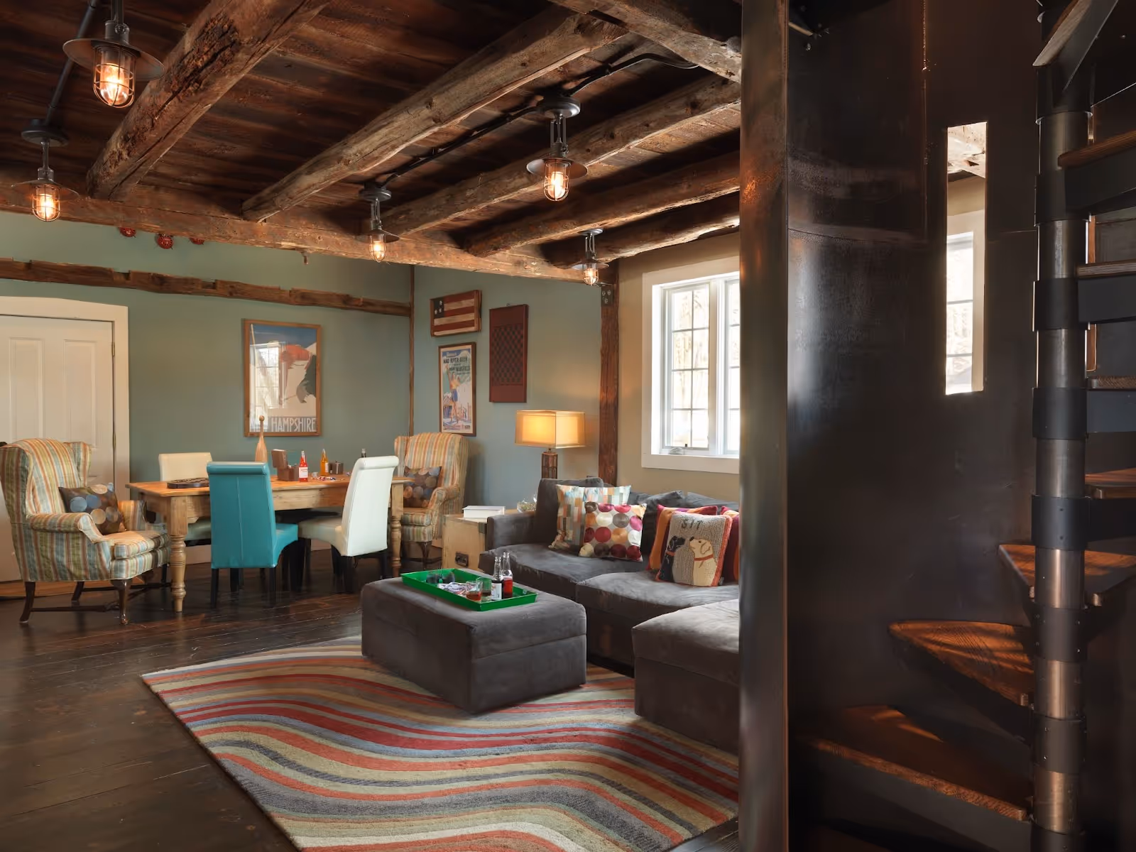 Antique 1850's barn with spiral staircase and decorative lighting.