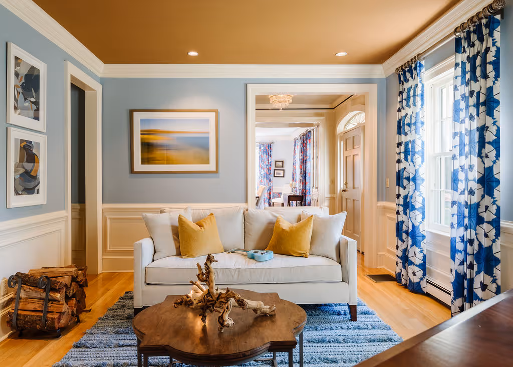 COlorful living room with painted ceiling