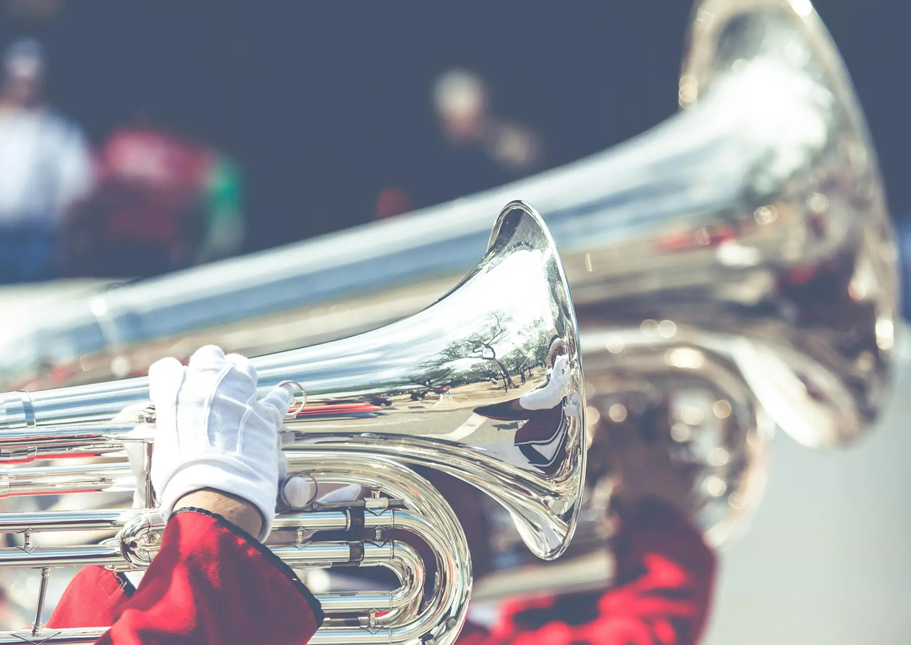 Band fundraiser ideas shown with a high school marching band performing at a football game.
