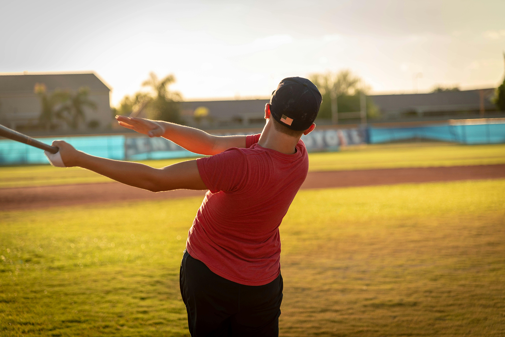 Baseball fundraiser where a player is participating in a hit-a-thon.