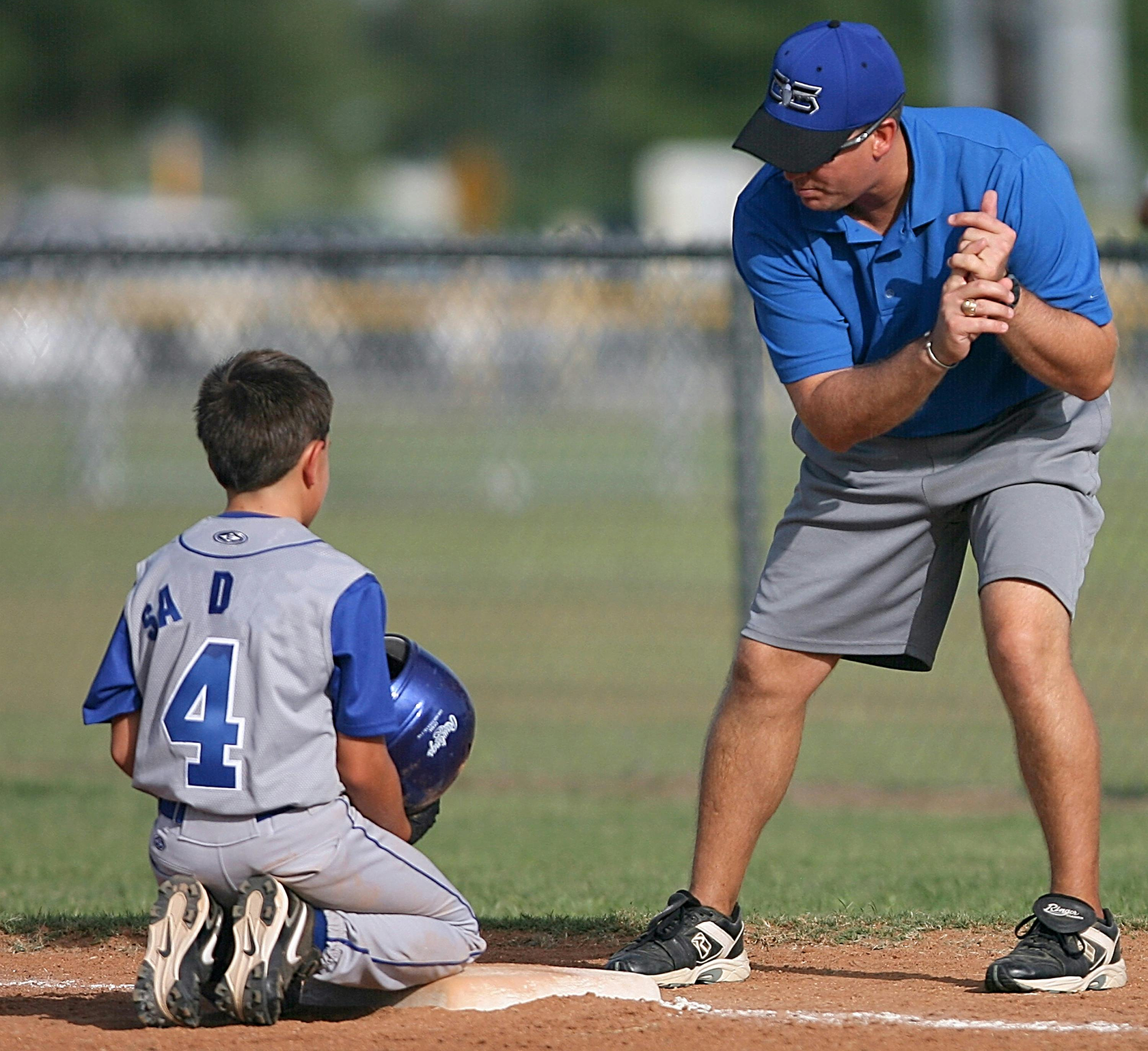 Baseball coach during a summer camp fundraiser.