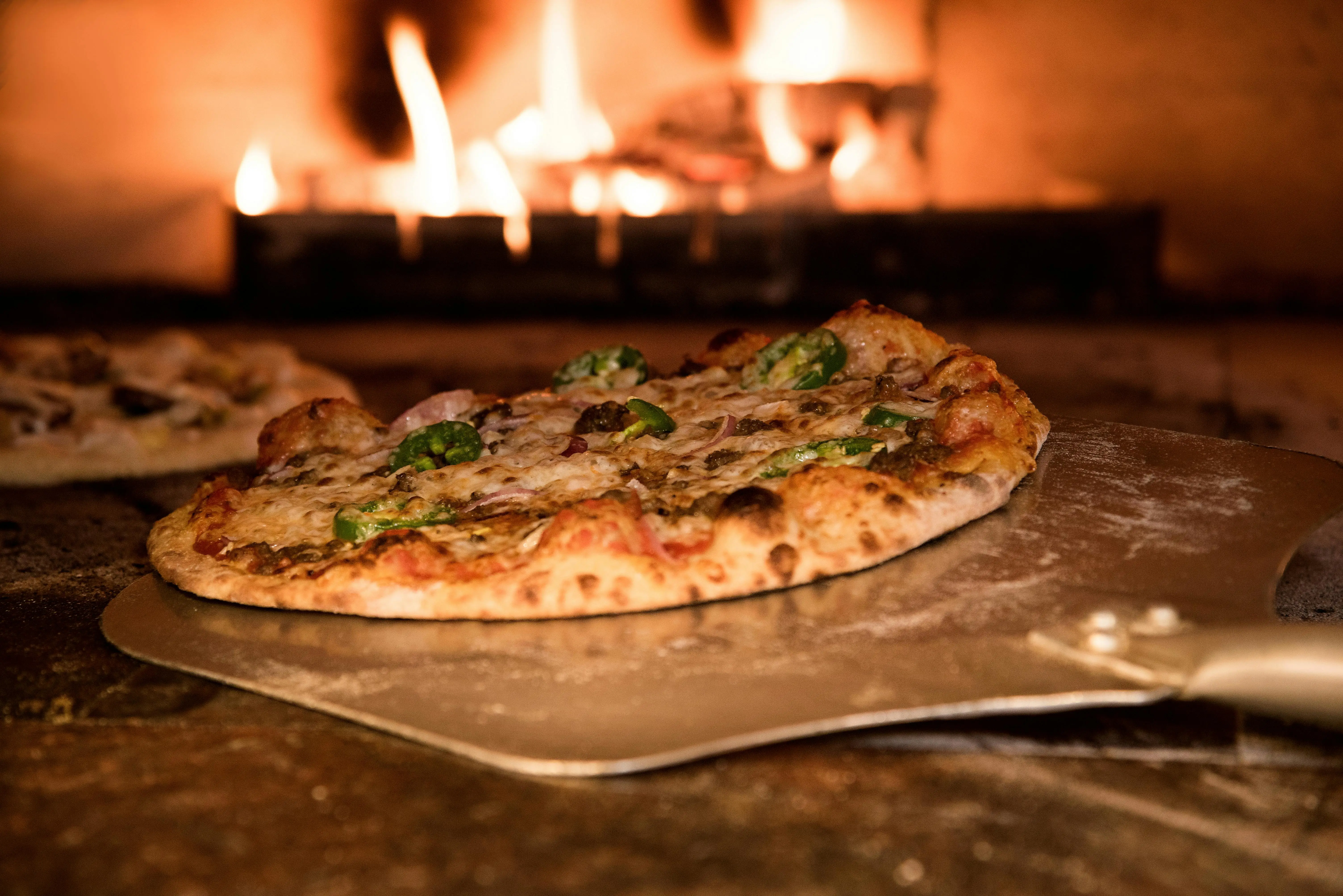 An out of the box track and field fundraising idea, make your own pizza.