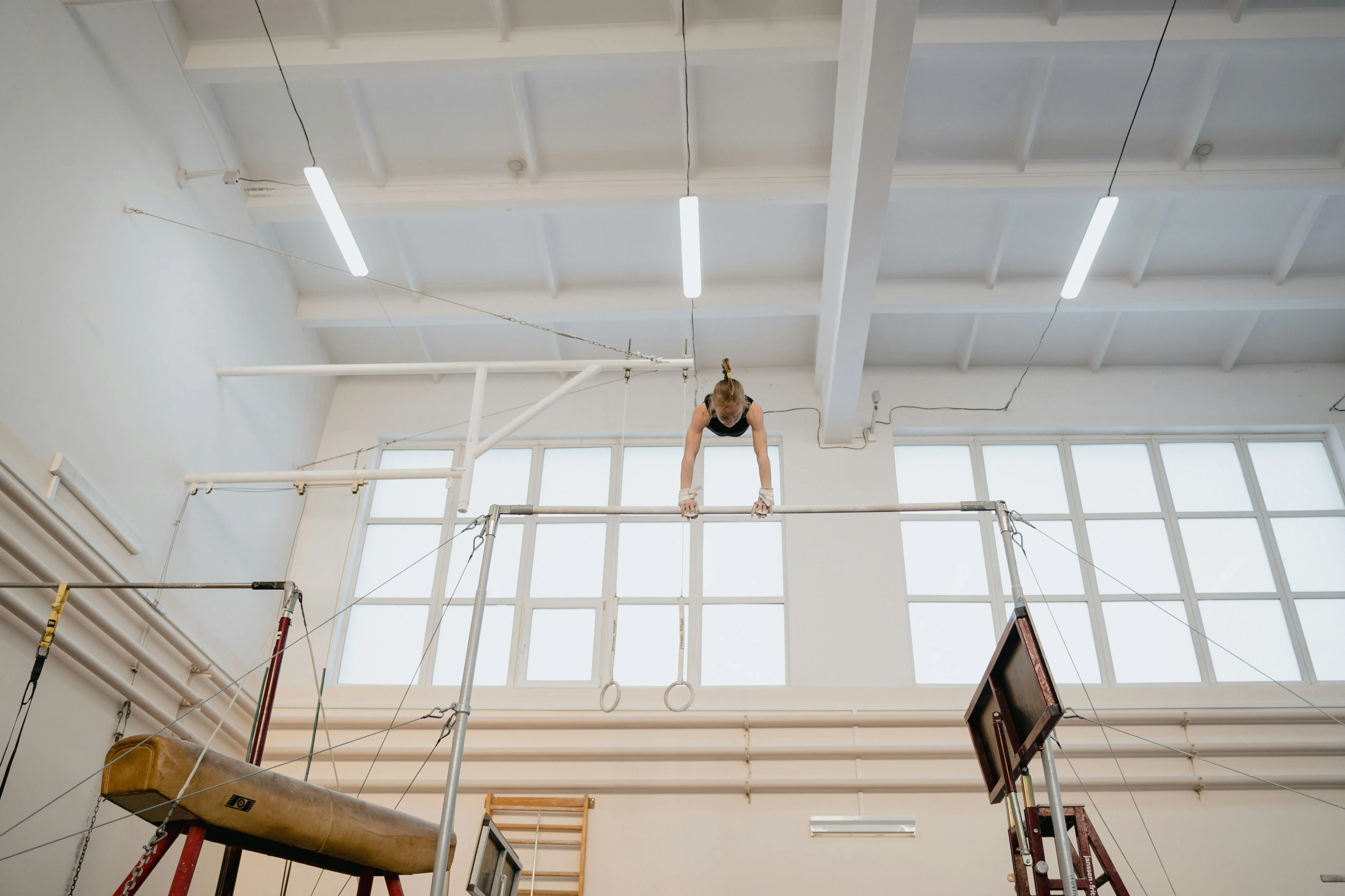 Gymnasts can benefit from gymnastics fundraising ideas to buy new equipment, like uneven bars.