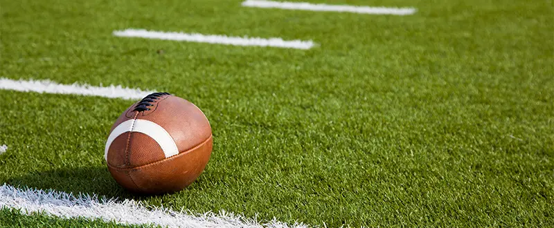 A football on a field after a football fundraiser.