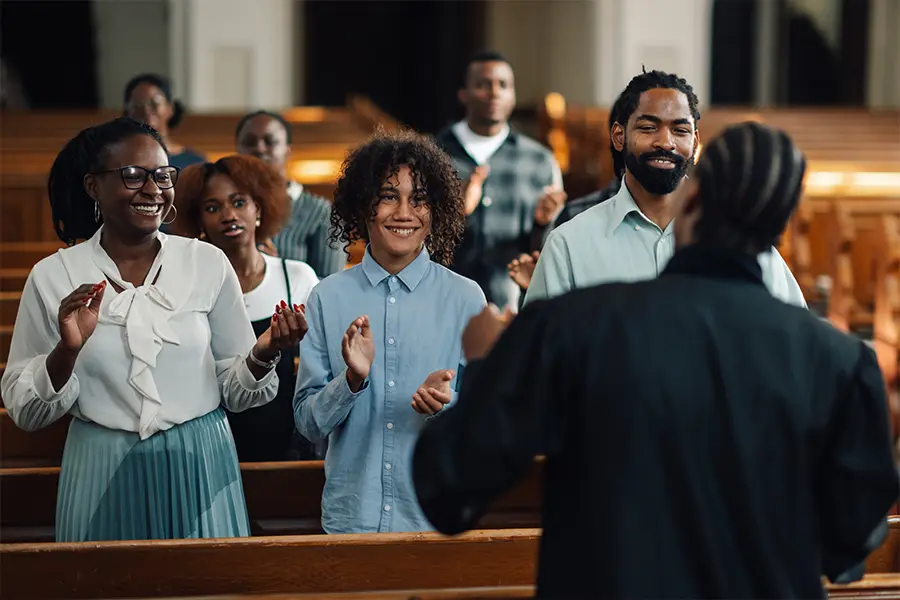Churchgoers sing during a concert fundraiser practice sessions at a church.