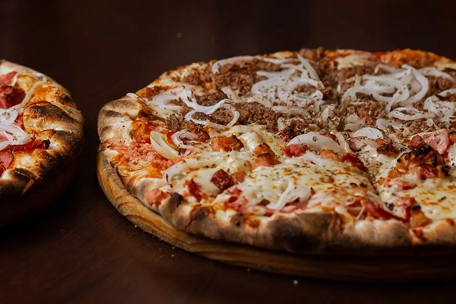 Pizza laid out during a volleyball build a pizza night.