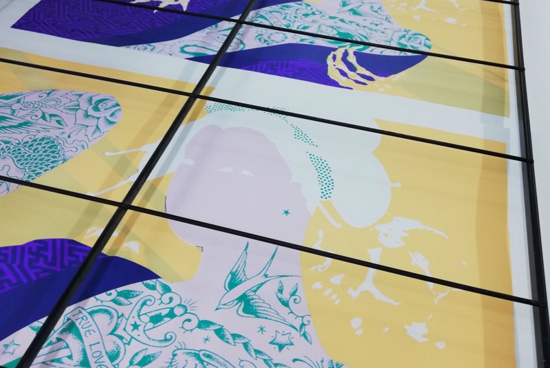 Screen printed art laid out to dry