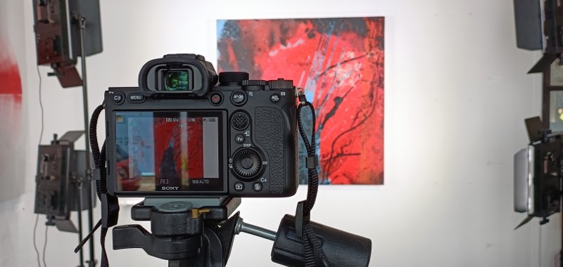 Hanging artwork being photographed