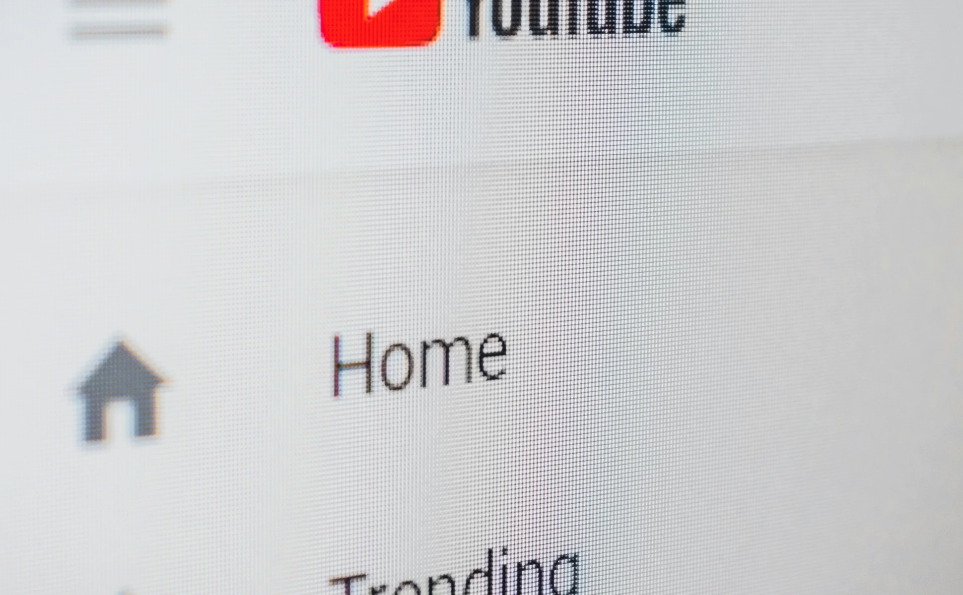 YouTube website homepage featuring the logo, search bar, and sidebar navigation menu.